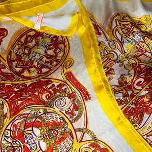Beautiful Hermes Paris silk scarf. Colors: Yellow, Orange and purple.